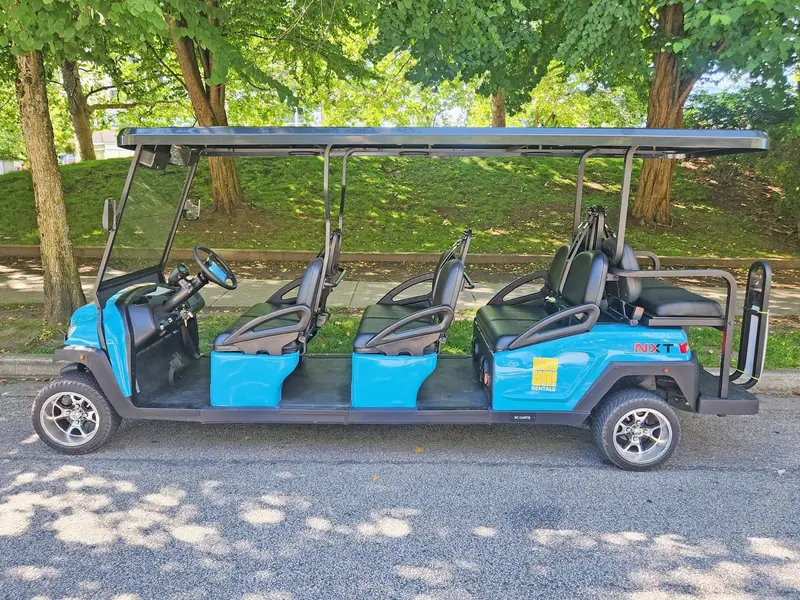 Side view of a blue eight-seat HeyYa cart